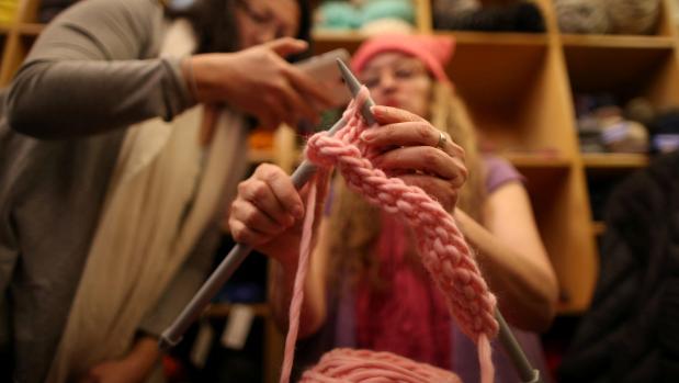 Women knit symbolic pink hats for rally after Trump inauguration